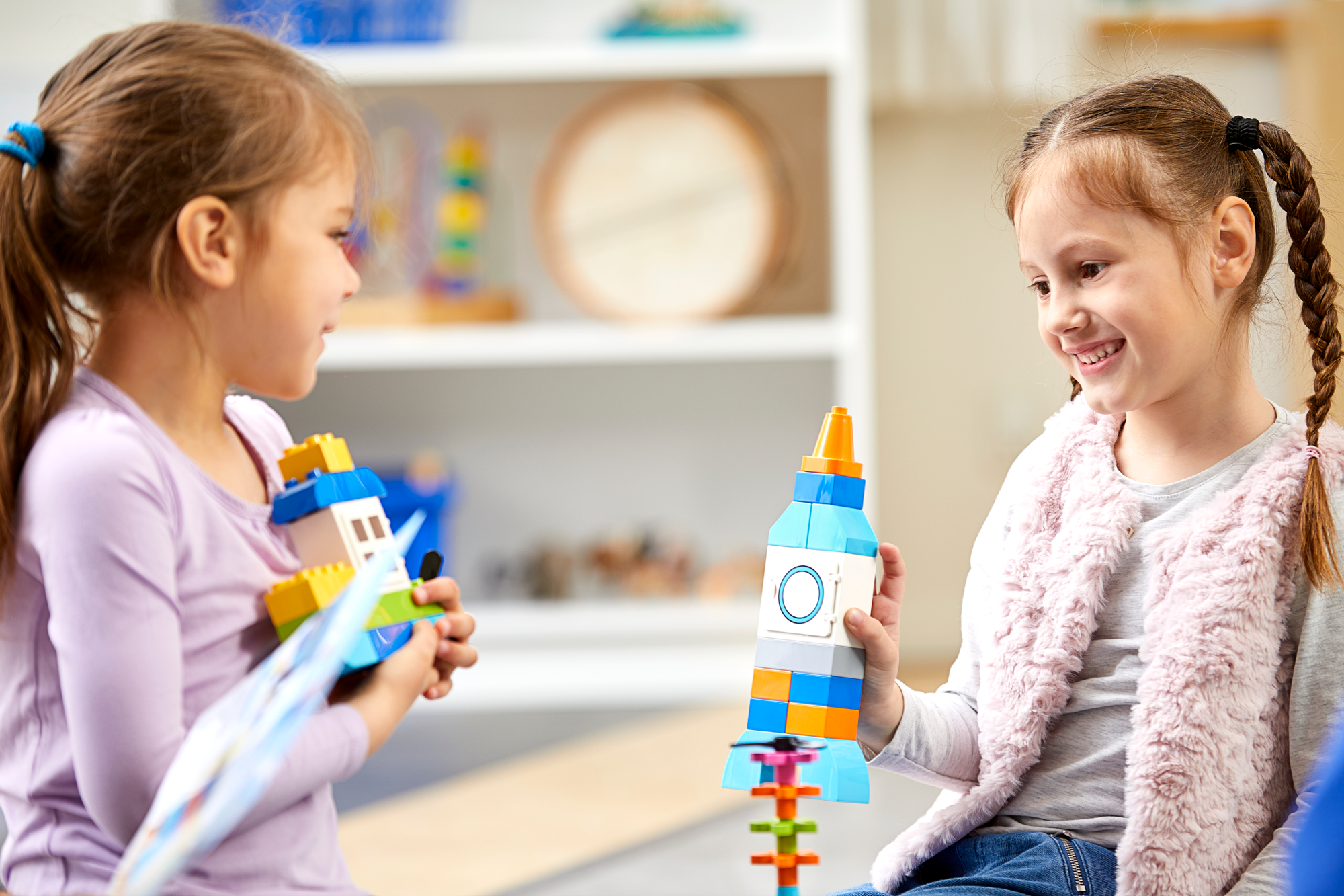 Two preschool children playing with LEGO Education My XL World